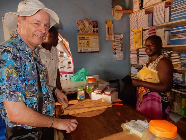 Buying maths sets for the top class in Naluwerere, Uganda.